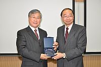 Prof. Henry Wong (right), Pro-Vice-Chancellor presents a souvenir to Prof. Wang Guangtao (left).